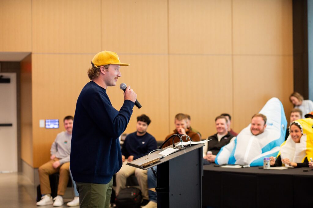 Workshop team member speaking at an all hands meeting.