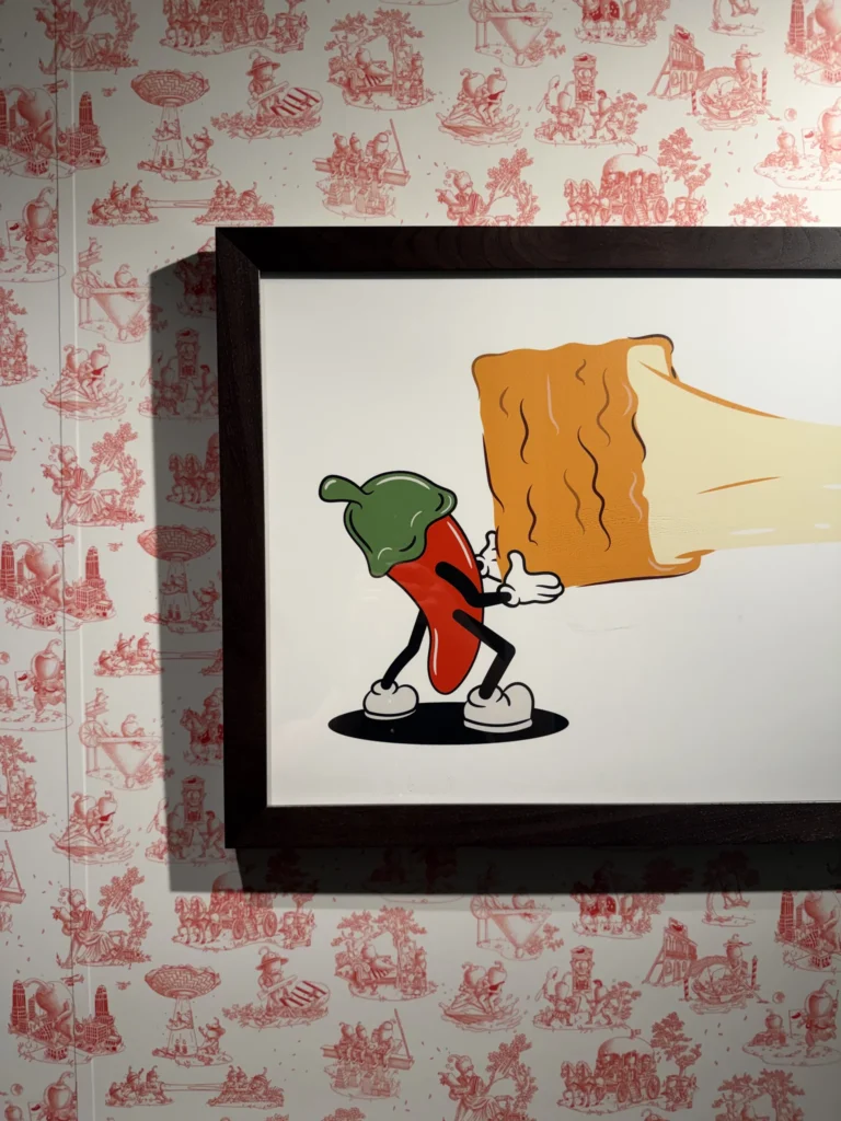 image of pepper pulling mozzerela stick